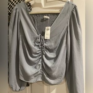 Light grey. Blouse size medium. Never used.
